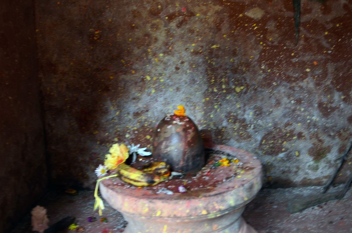 Kathmandu Changu Narayan 32 Shiva Lingam In Small Temple In North East Corner Of Changu Narayan A Shiva lingam sits inside the small temple in the north east corner of Changu Narayan to the right of the compound entrance.